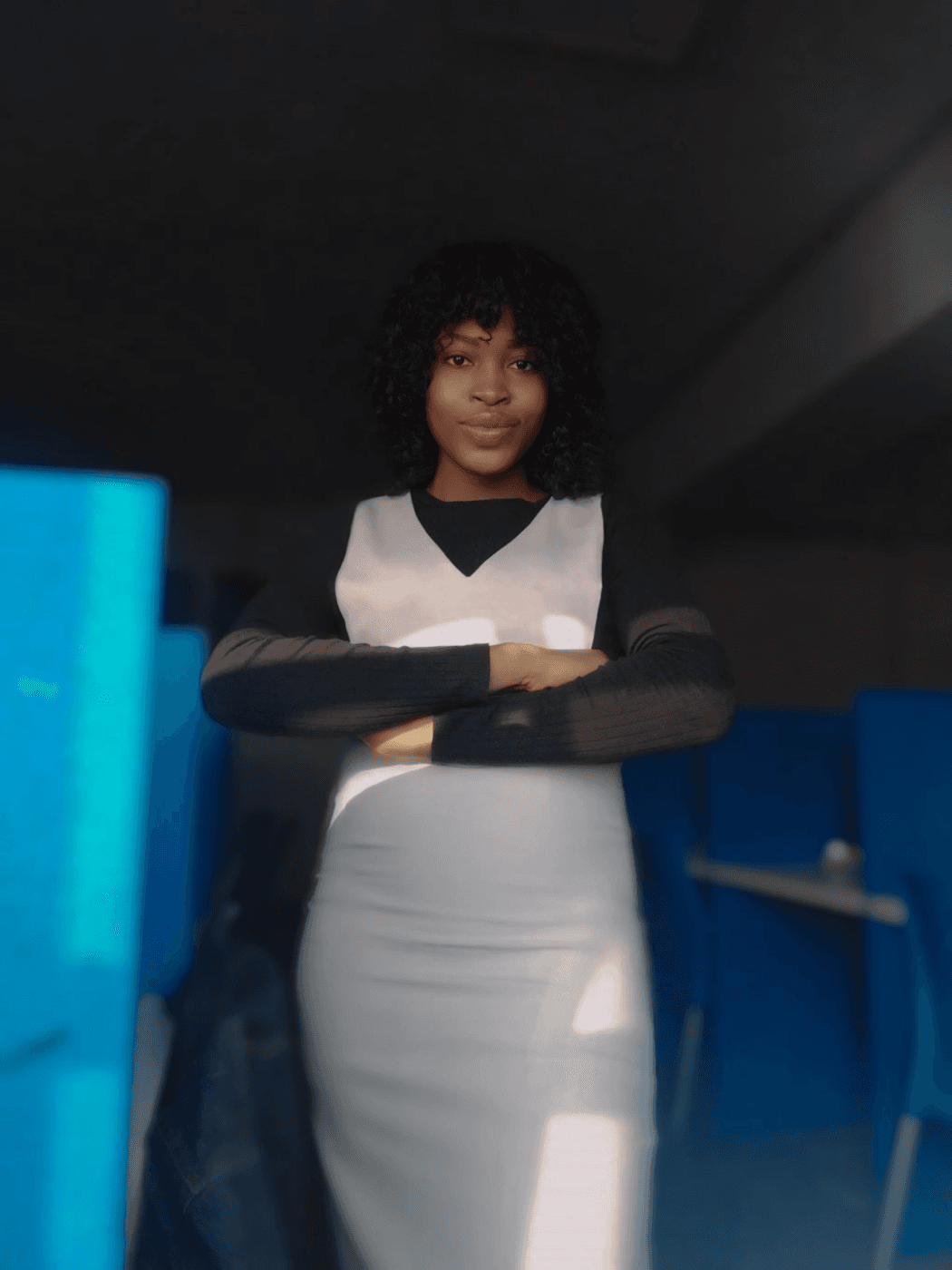 Christiana Ifenkwe profile photo in a restaurant wearing a formal black and white dress